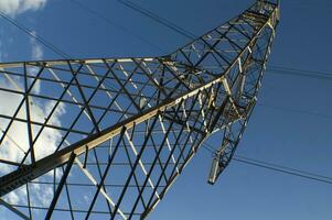 a large electrical tower with wires and wires photo