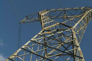 a large electrical tower with wires and wires photo