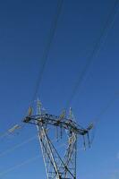 a large electrical tower with wires and wires photo