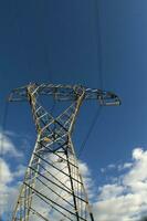 a large electrical tower with wires and wires photo