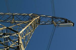 a large electrical tower with wires and wires photo