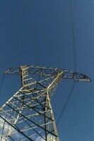 a large electrical tower with wires and wires photo