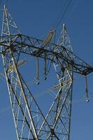 a large electrical tower with wires and wires photo