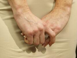 a woman is holding her stomach photo