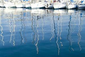 the boats are all white photo