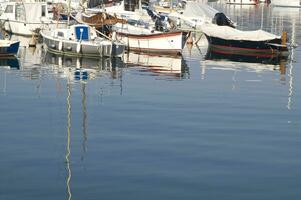 the boats are all white photo