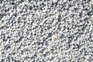 white pebbles are piled up in a pile photo