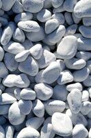 white pebbles are piled up in a pile photo