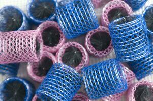 a pile of blue and pink mesh bags photo