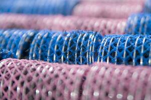 a pile of blue and pink mesh bags photo