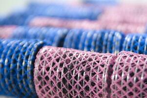 a pile of blue and pink mesh bags photo