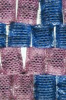 a pile of blue and pink mesh bags photo