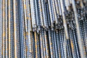 a pile of steel bars with rust on them photo