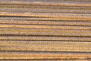 a pile of steel bars with rust on them photo