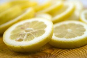 sliced lemon on a wooden cutting board photo