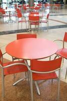 a table and chairs in a restaurant photo