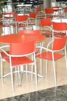 a table and chairs in a restaurant photo