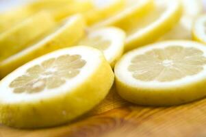 sliced lemon on a wooden cutting board photo