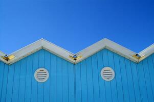 a blue building with white trim photo