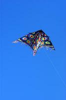 Set of flying colorful kites photo