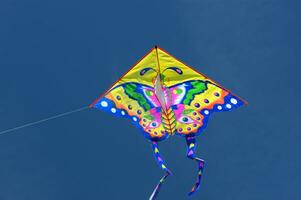 Set of flying colorful kites photo