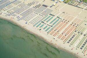 a beach with many people on it photo