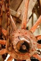 Ancient wooden wheel of an old wagon photo