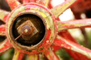 Ancient wooden wheel of an old wagon photo