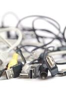 a hand holding several different types of cables photo