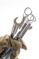 a pair of gloves with a wrench and a pair of pliers photo