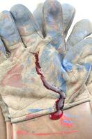 a glove with blood on it photo