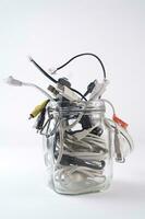 a glass jar filled with wires photo
