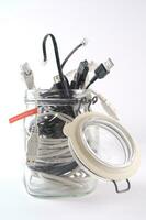 a glass jar filled with wires photo
