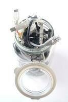 a glass jar filled with wires photo