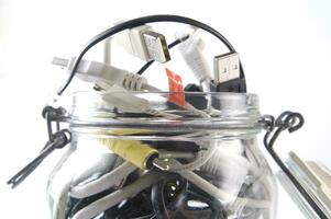 a glass jar filled with wires photo