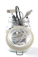 a glass jar filled with wires photo