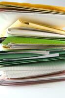 Stack of practices to be processed in the office photo