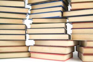 a pile of books on a white background photo