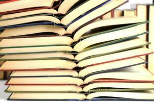 a stack of books on a white background photo