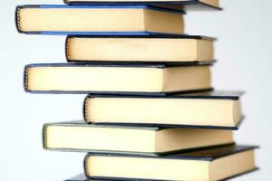 a stack of books on a white background photo