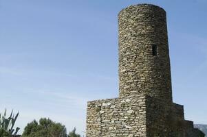 a tall stone tower photo