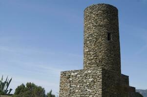 a tall stone tower photo