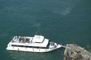 two boats traveling in the ocean photo