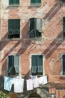 clothes hanging on the windows to dry photo