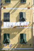 clothes hanging on the windows to dry photo