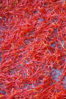 a pile of red saffron on a plate photo