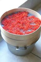 a pile of red saffron on a plate photo
