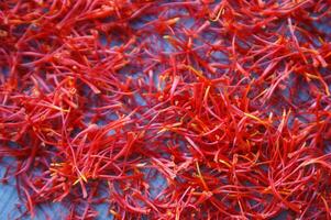 a pile of red saffron on a plate photo