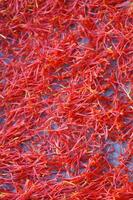a pile of red saffron on a plate photo