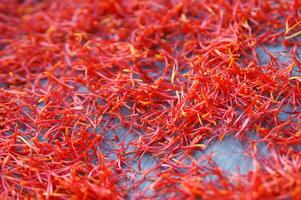 a pile of red saffron on a plate photo